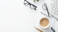 Flat lay of workspace with coffee, glasses, keyboard, and pencil Royalty Free Stock Photo