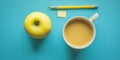 A flat lay of a yellow apple a cup of coffee a pencil and a sticky note on a blue background Royalty Free Stock Photo