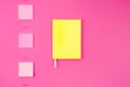 flat lay with yellow notebook with stickers and paper clips Royalty Free Stock Photo