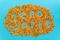 Zero waste creative handwritten text. Colorful legumes: red lentils and split peas scattered at blue color background.