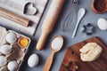 Flat layout composition, baking ingredients and kitchen utensils on a gray background. Culinary trendy background. The concept of
