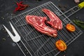 Flat layout of lamb chop on a grilling rack