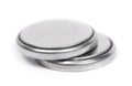 Flat lithium round button cell battery isolated over white Royalty Free Stock Photo