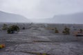 Flat low crack surface of volcanic landscape under low mist