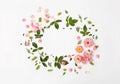 Flat nature floral round frame on white background, top view.