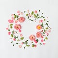 Flat nature floral round frame on white background, top view.