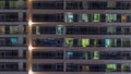 Flat night panorama of multicolor light in windows of multistory buildings aerial timelapse. Royalty Free Stock Photo