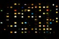 Flat night panorama of multicolor light in windows of multistory buildings. life in big city