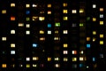 Flat night panorama of multicolor light in windows of multistory buildings. life in big city