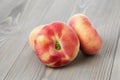 Flat peaches on wood table