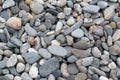 Flat pebble texture natural stone background, top view. Flat stones of various colors and sizes