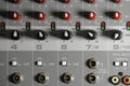 Flat perspective of PA system mixer controls. Macro, shallow depth of field