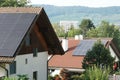 Flat plate or panels of solar collectors on the roofs of the the family house for active heating Royalty Free Stock Photo