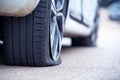 Flat punctured car wheel, emergency stop on the road. Mobile tire service Royalty Free Stock Photo