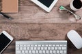 Flat ray or top view workspace business desk with computer, coffee cup, notebook, smartphone, office supplies and cell phone wood Royalty Free Stock Photo