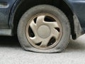 Flat rear tire on car Royalty Free Stock Photo