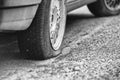 Flat rear tire on a car Royalty Free Stock Photo