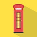 Flat red pay phone with yellow background Royalty Free Stock Photo
