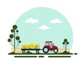 Flat red tractor with a cart corn. The agricultural machinery transports