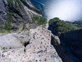 Flat rock Preikestolen over fjord Lysefjorden is natural attraction. Top view and flight up above cliff. Preacher`s Pulpit or Pre Royalty Free Stock Photo