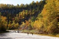 The flat rock and river bed at Taughannock Falls with the background of fall foliage in Upstate New York, U.S Royalty Free Stock Photo