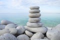 Flat rocks stacked on top of each other as a symbol of zen, harmony and balance.