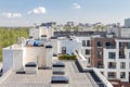 Flat roof with air conditioners on top modern apartment house building exterior mixed-use urban multi-family residential district Royalty Free Stock Photo