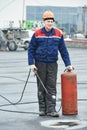 Flat roof covering repair worker