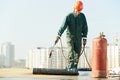 Flat roof covering repair works with roofing felt Royalty Free Stock Photo