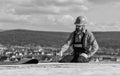 Flat roof installation. Roofer constructing new roof. Estimate materials requirements for projects. Install roofing Royalty Free Stock Photo