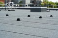 Flat roof protective covering with bitumen membrane for waterproofing Royalty Free Stock Photo