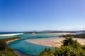 Flat sand dunes at delta of Nambucca river entering Pacific ocean through wide sandy beach of Australian coast around Nambucca Royalty Free Stock Photo