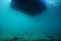 Sandy bottom under floating jetty Royalty Free Stock Photo