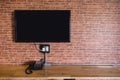 Flat screen television on a brick wall Royalty Free Stock Photo