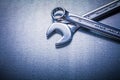 Flat spanner and hook wrench on metallic Royalty Free Stock Photo