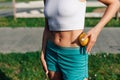 flat sports belly of young woman and spiky myofascial ball for improving lymphatic drainage system, concept of health