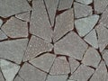 Flat stones and red granite chips between as background Royalty Free Stock Photo