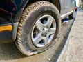 Flat tire on the Volkswagen car Royalty Free Stock Photo