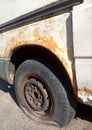 Flat tire and rusty car, old car elements Royalty Free Stock Photo