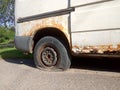 Flat tire and rusty car, old car elements Royalty Free Stock Photo