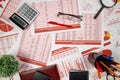 Flat top view of business workspace - reports with data, tables and analytic chart. Business financial accounting concept