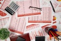 Flat top view of business workspace - reports with data, tables and analytic chart. Business financial accounting concept