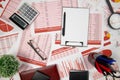 Flat top view of business workspace - reports with data, tables and analytic chart. Business financial accounting concept