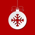 Flat white Christmas bauble with shadow on red backgrou Royalty Free Stock Photo