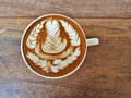 Flat white coffee with latte art Rosetta.