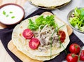 Flatbread with meat, onions, lettuce and tomatoes Royalty Free Stock Photo