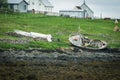 Flatey Island, Iceland - July 2, 2023: Old abandoned shipwreck fishing boat on a beach