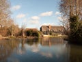 flatford black farm house mill house cottage from across the water Royalty Free Stock Photo