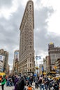 Flatiron Building New York City with lots of People standing in the forefront Royalty Free Stock Photo