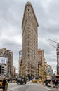 Flatiron Building New York City with street and yellow taxi cabs in forefront Royalty Free Stock Photo